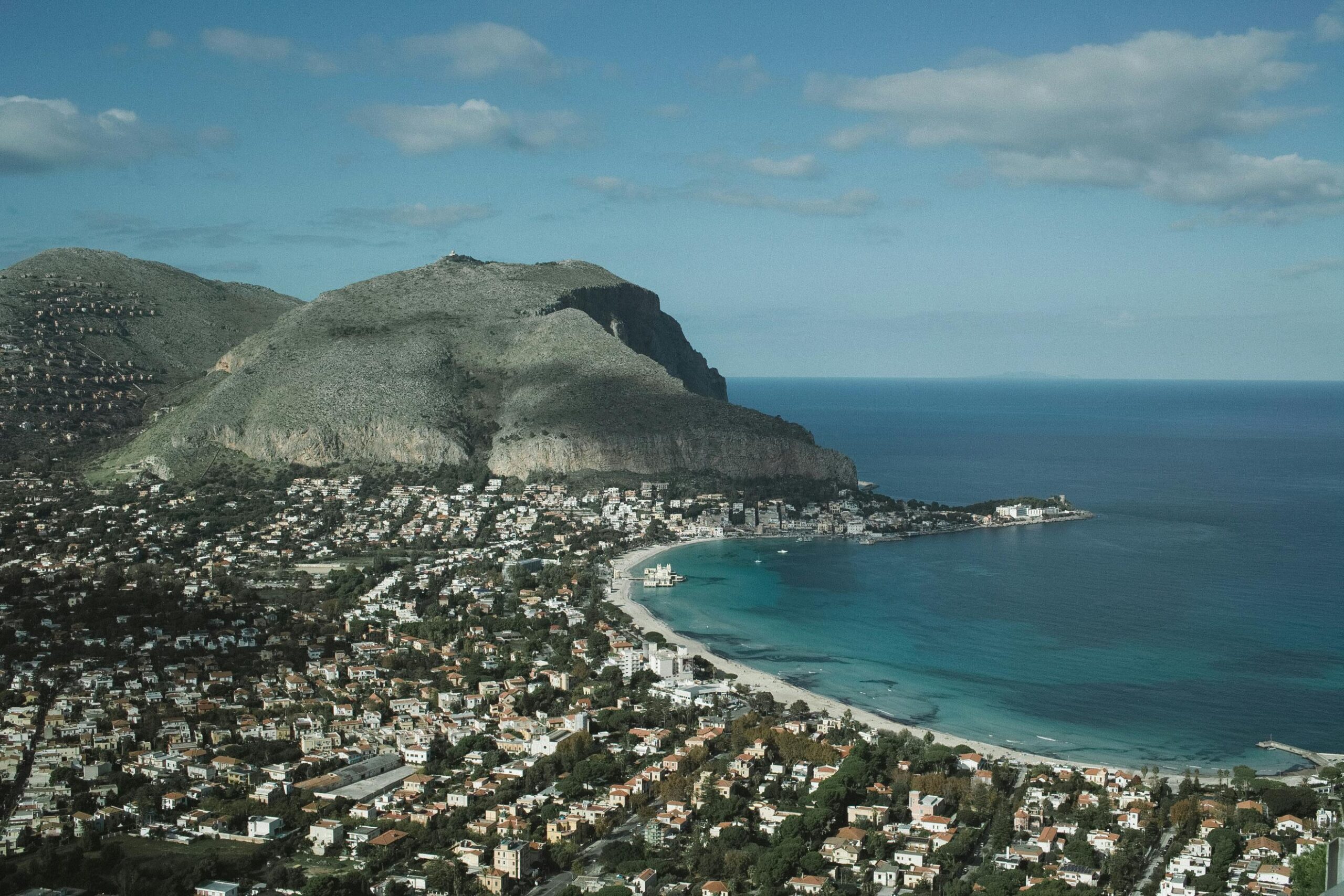 A breathtaking aerial view of Mondello Beach and mountains in Palermo, Sicily.